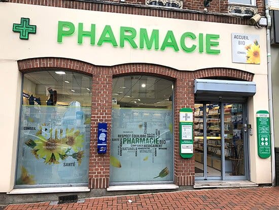 Pharmacy storefront with green signage